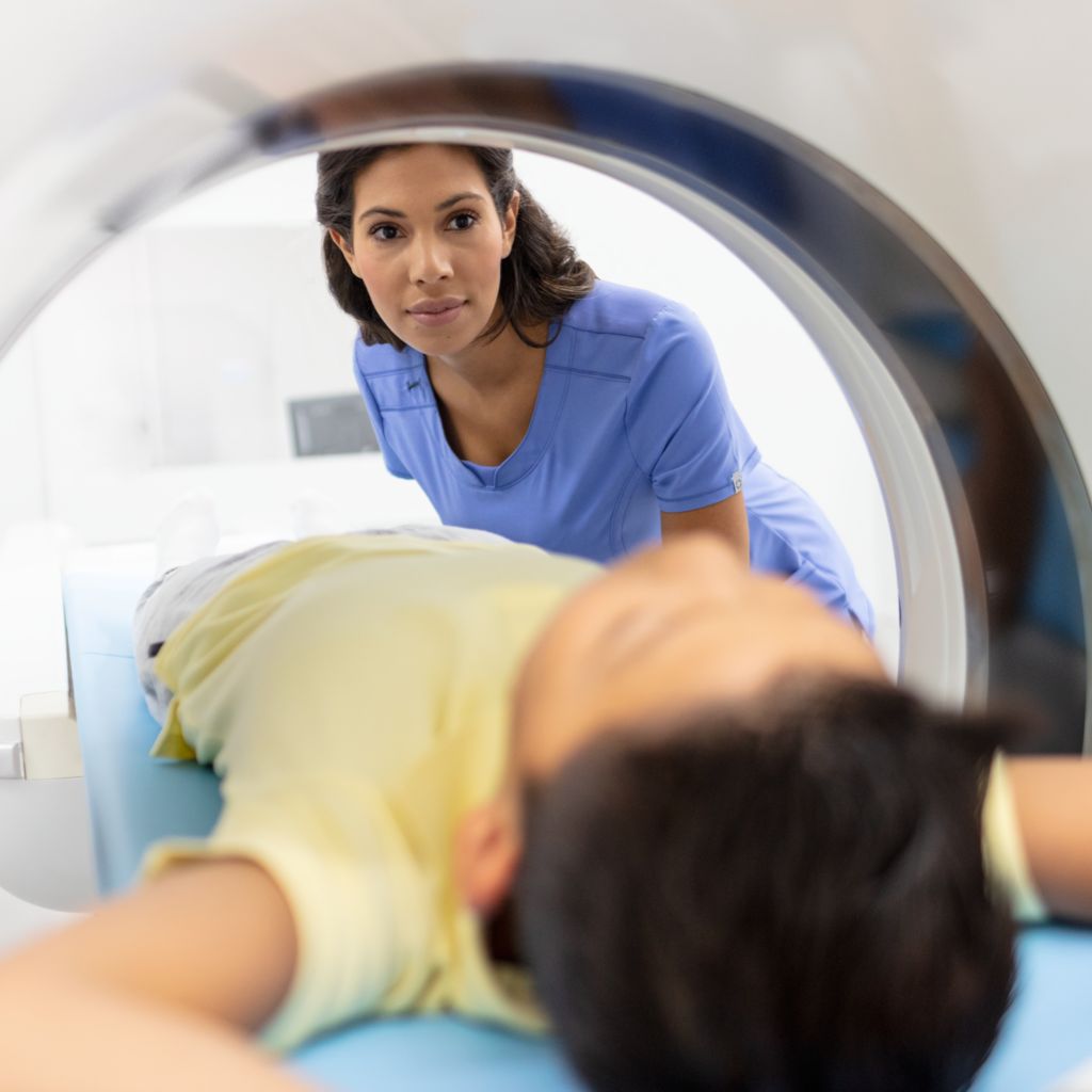 Tech positioning pediatric patient
