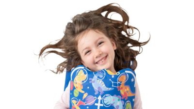 Child wearing colorful Snuggle pediatric MRI coil designed for 3T imaging
