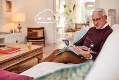 man reading paper with illustration of data