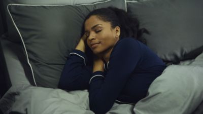Woman Sleeping In Bed