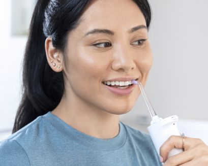 Patient using power flosser.