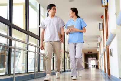 Nurses Walking in Hospital Hallway