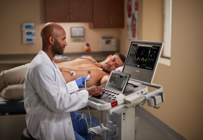 Compact US 5500CV ultrasound device in use with patient