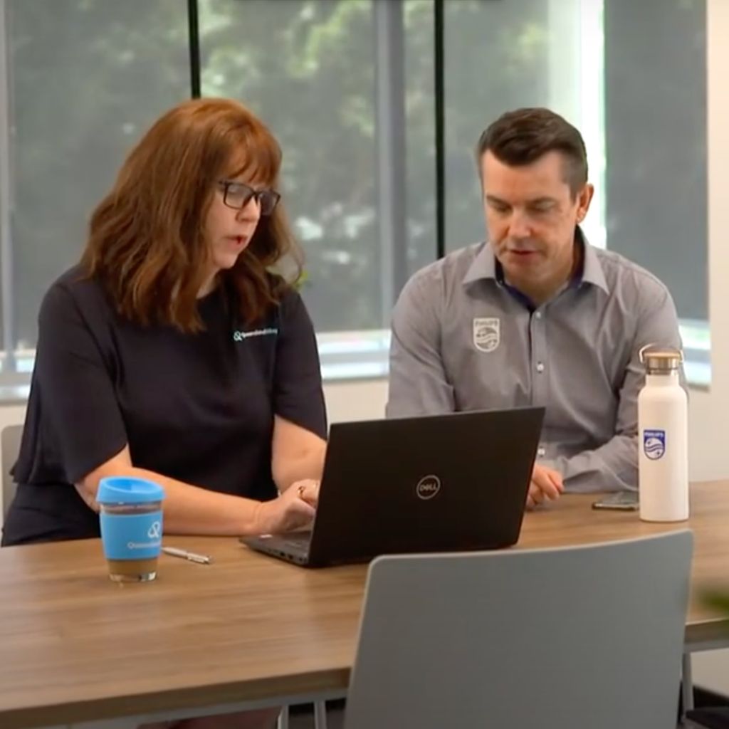 Two business people collaborating at a table