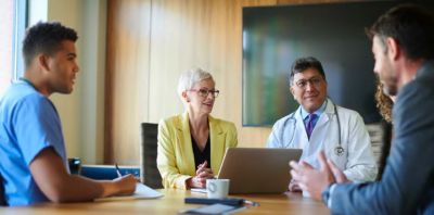 CFO and hospital administration meet to discuss enterprise as-a-service options