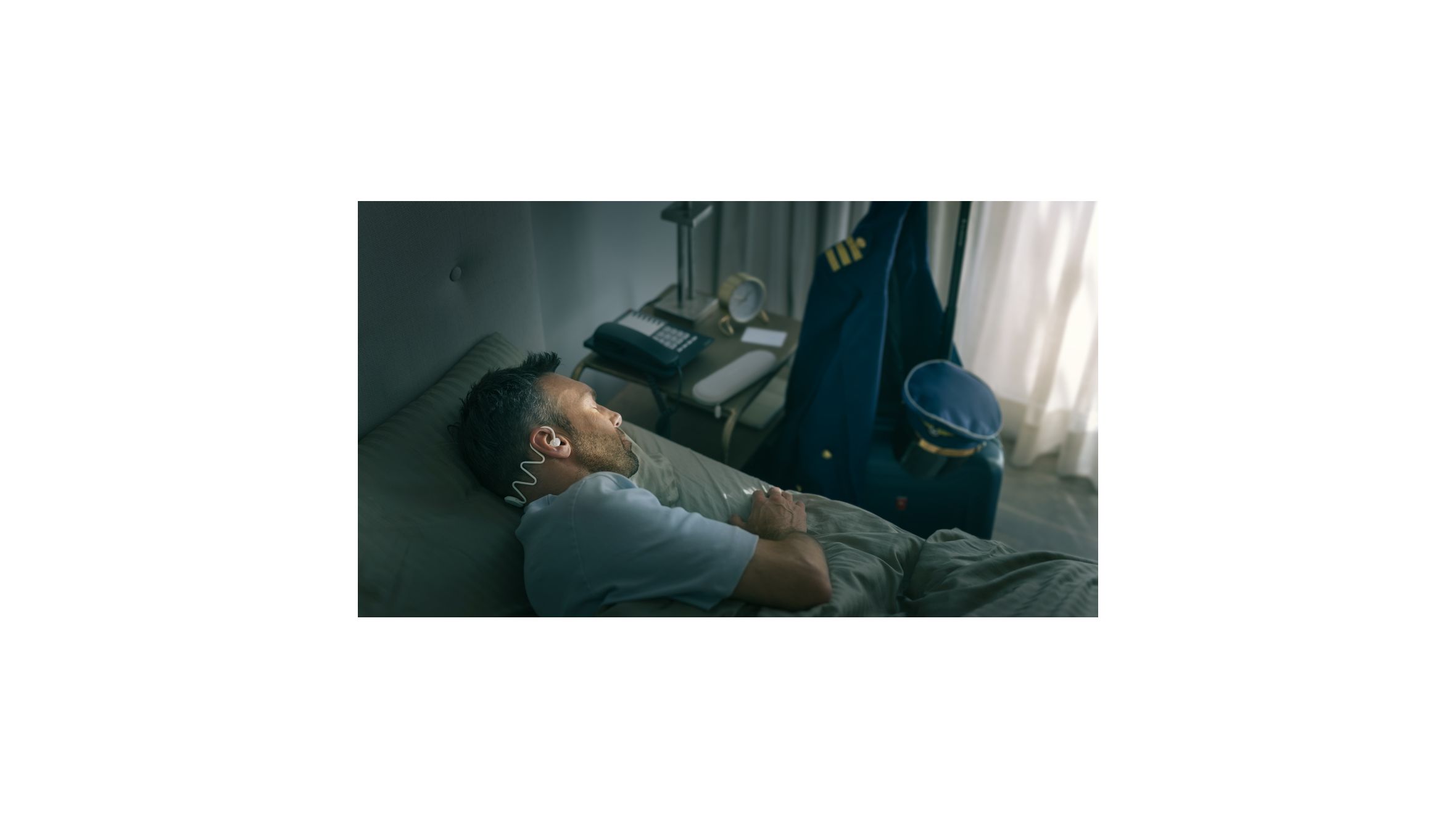 Image showing Philips Sleep Headphones that fit around a man&rsquo;s head tightly, but comfortably.