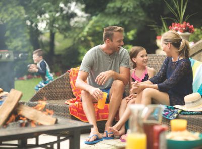 Family sitting outside sharing story