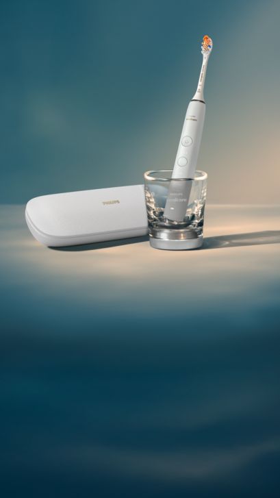 A DiamondClean Smart, glass charger and case on a counter.