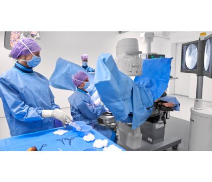Surgical team performing urology case with Zenition II mobile C-arm