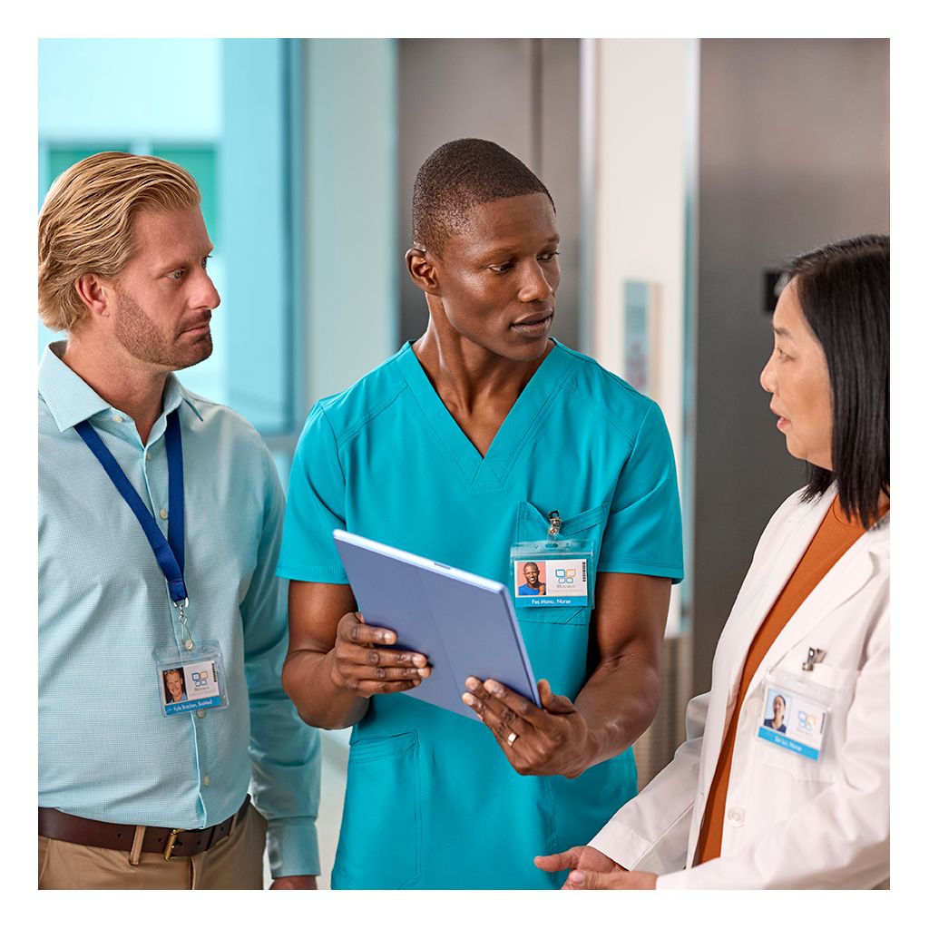 IT manager, nurse, doctor in hallway with tablet