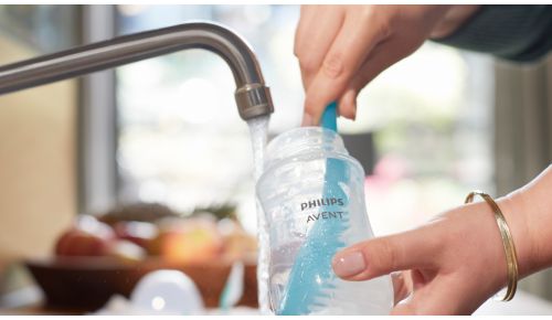 Bottle brush with curved head for easy cleaning