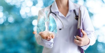 Healthcare professional holding digital lung visualization symbolizing innovation in lung cancer care
