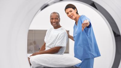 patient and tech in ct rt scanner