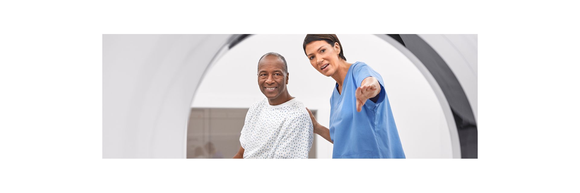 tech and patient in ct rt scanner