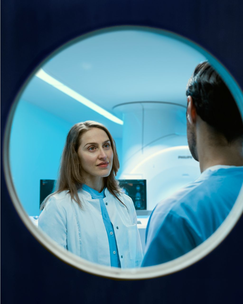 radiologist and technologist talking in the MR console room