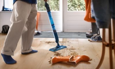 Person cleaning floor with electric mop