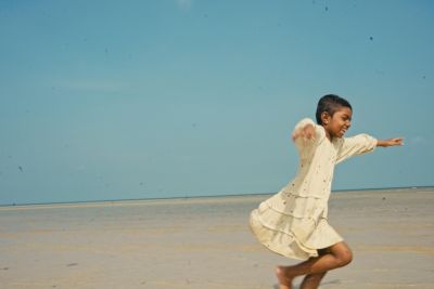 Child Running on Beach