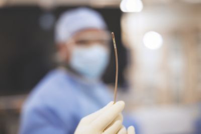 Clinician holding Philips VeriSight Pro intracardiac echocardiography catheter