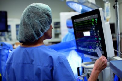 Woman in a hospital monitoring an IntelliVue patient monitor
