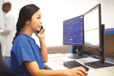 nurse at central station using PIC iX