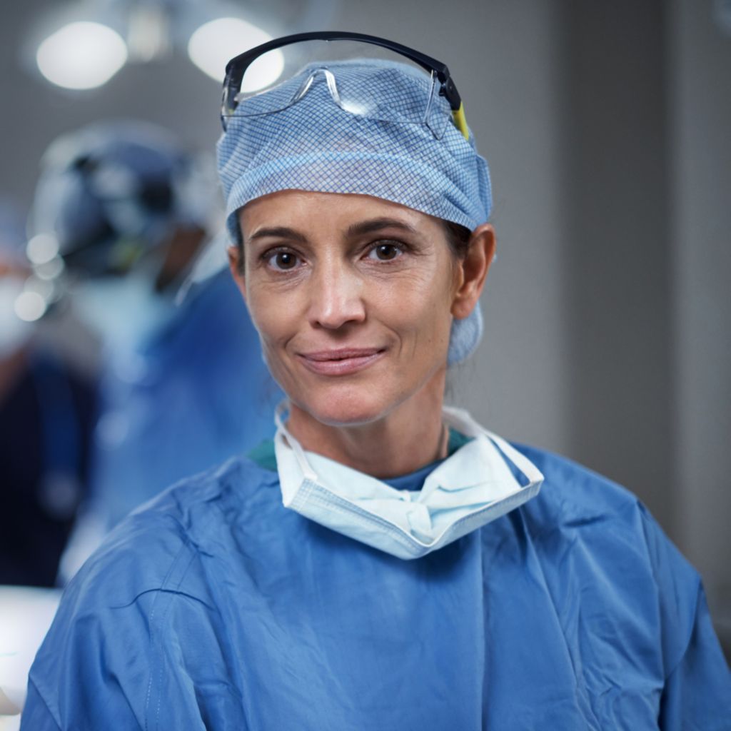 A surgeon standing in an operating room
