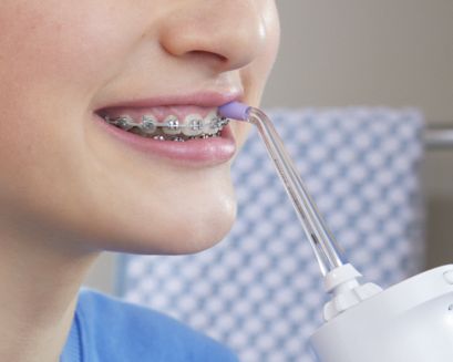 Patient using Power Flosser.