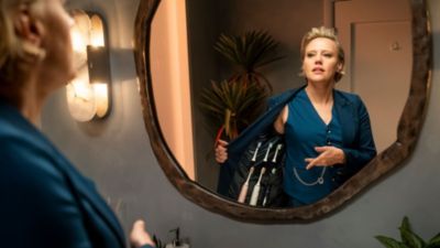 Kate McKinnon holding Philips Sonicare toothbrush during campaign shoot