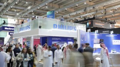 Philips exhibition booth at Global Health 2024 with healthcare professionals and visitors