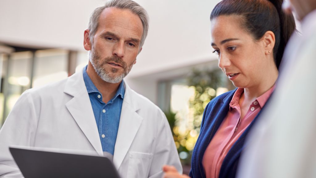 Head of radiology talking to a Philips expert on the financial details of the MR subscription business model