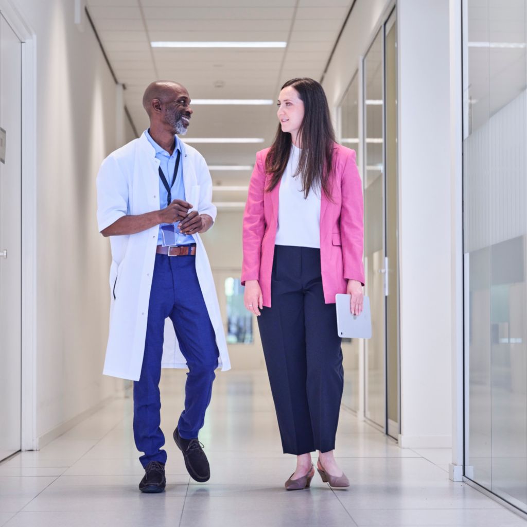Head of Department and Key Account Manager in Hospital Corridor 