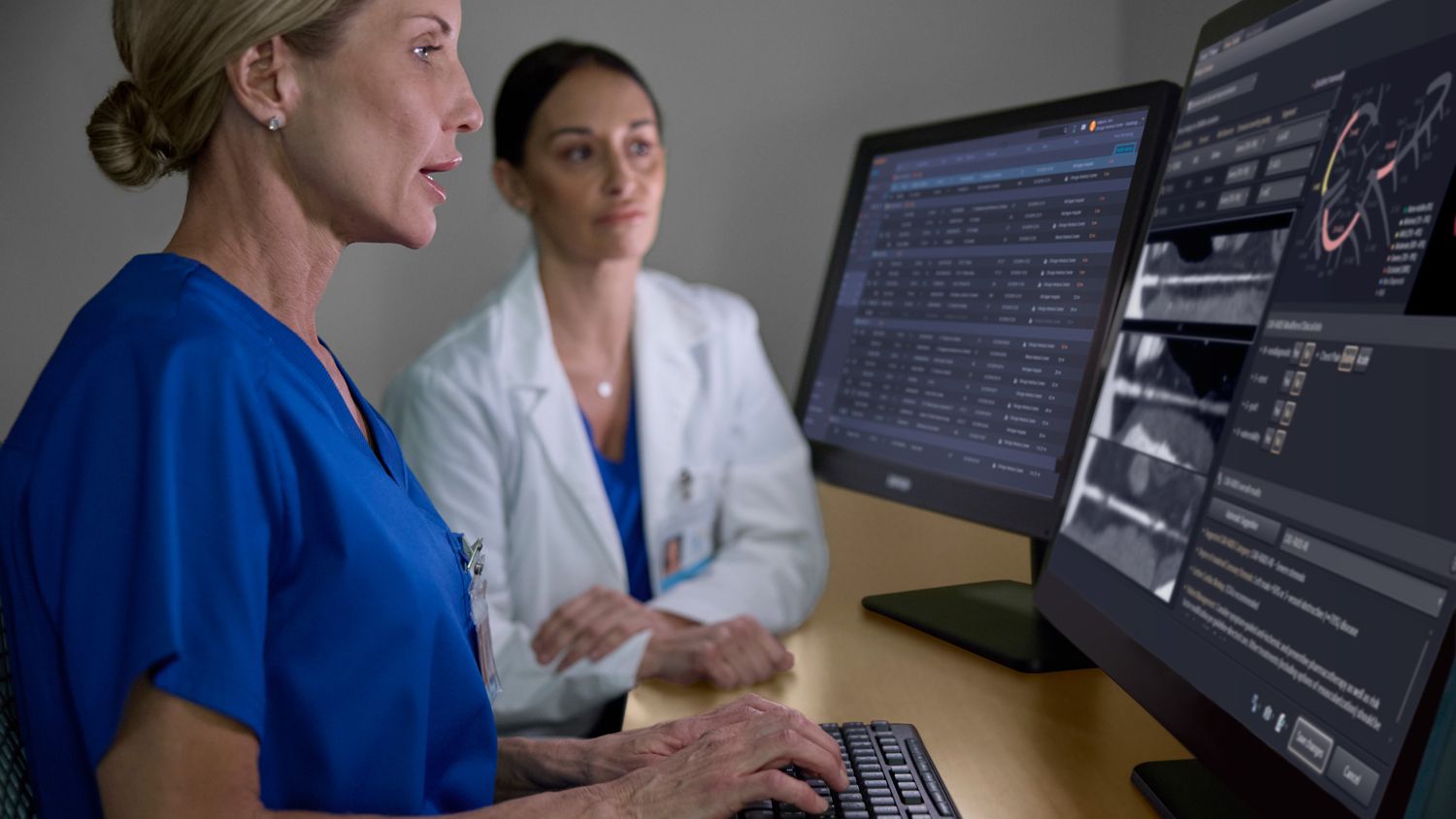 two women looking at screen