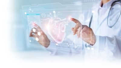 Doctor interacting with digital heart visualization representing AI driven healthcare technology