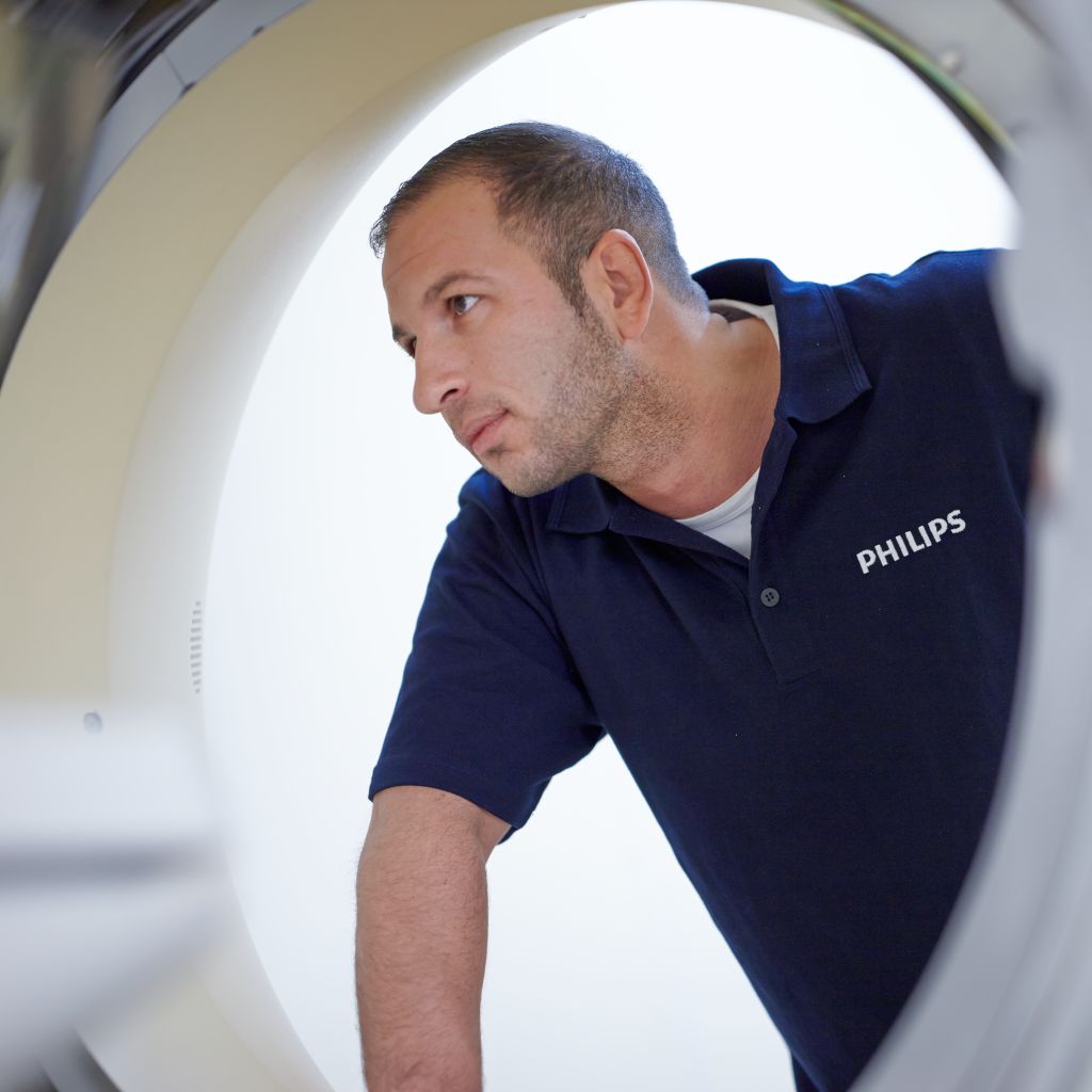 Philips engineer with CT machine