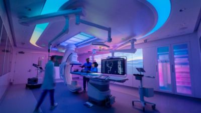 Clinicians operate Philips Azurion image-guided therapy system in ambiently lit interventional suite