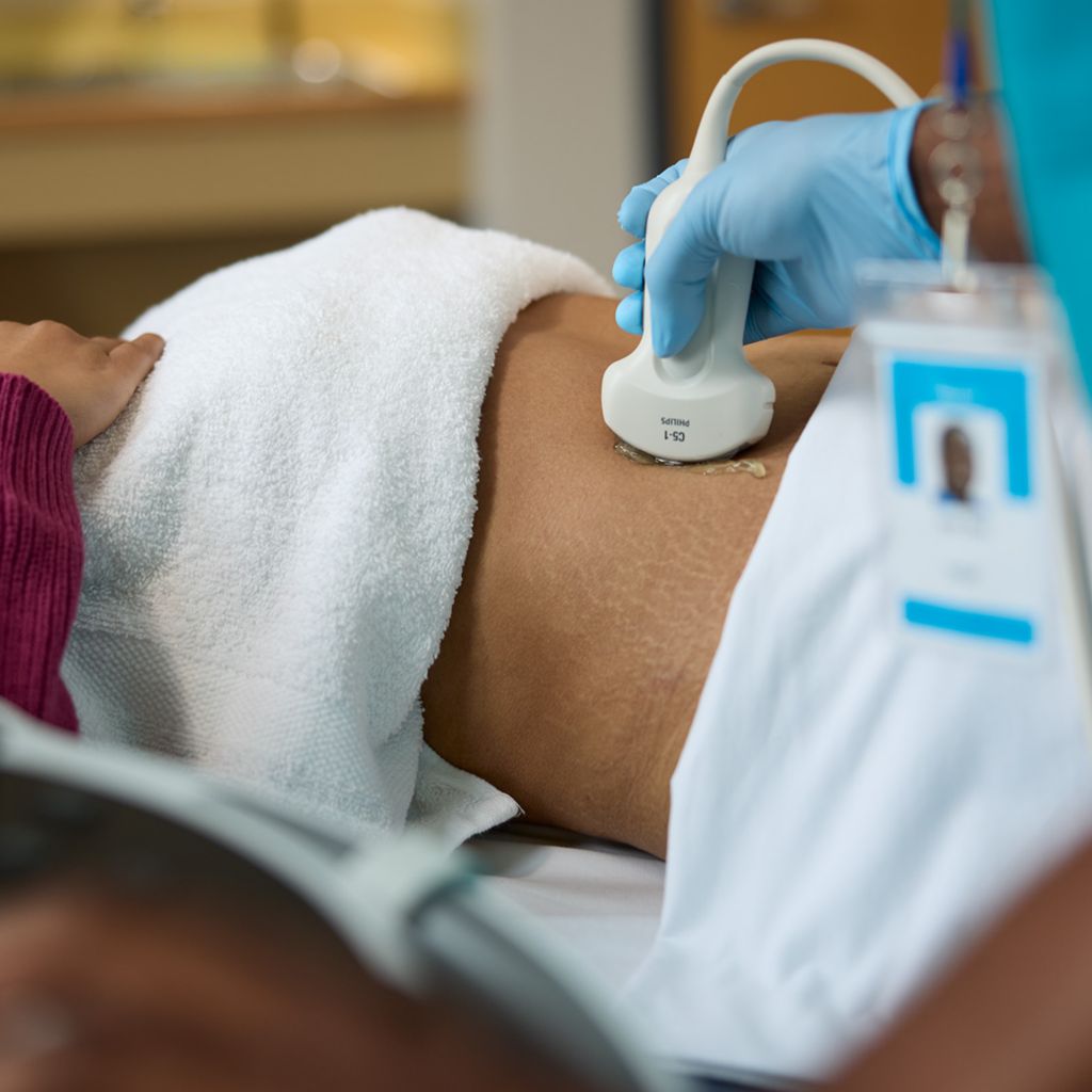 Ultrasound abdominal scanning a patient