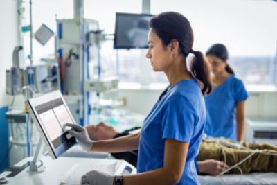 Clinician operating cardiac workstation during patient monitoring