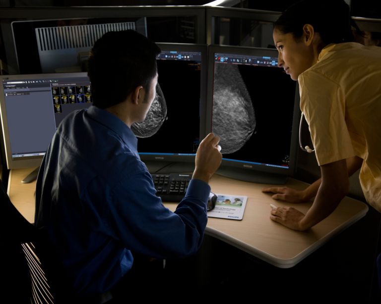 Radiologist in a dark room performing a Mammo Reporting thumbnail