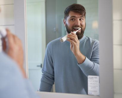 A mirror adorned with healthy habits sticker