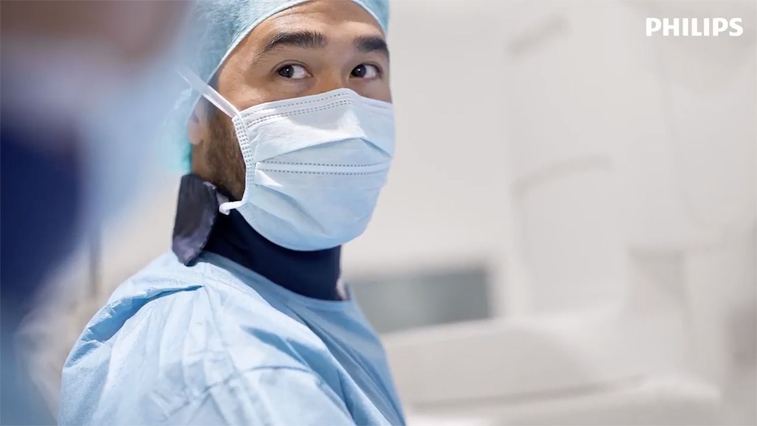 Masked physician in the cath lab