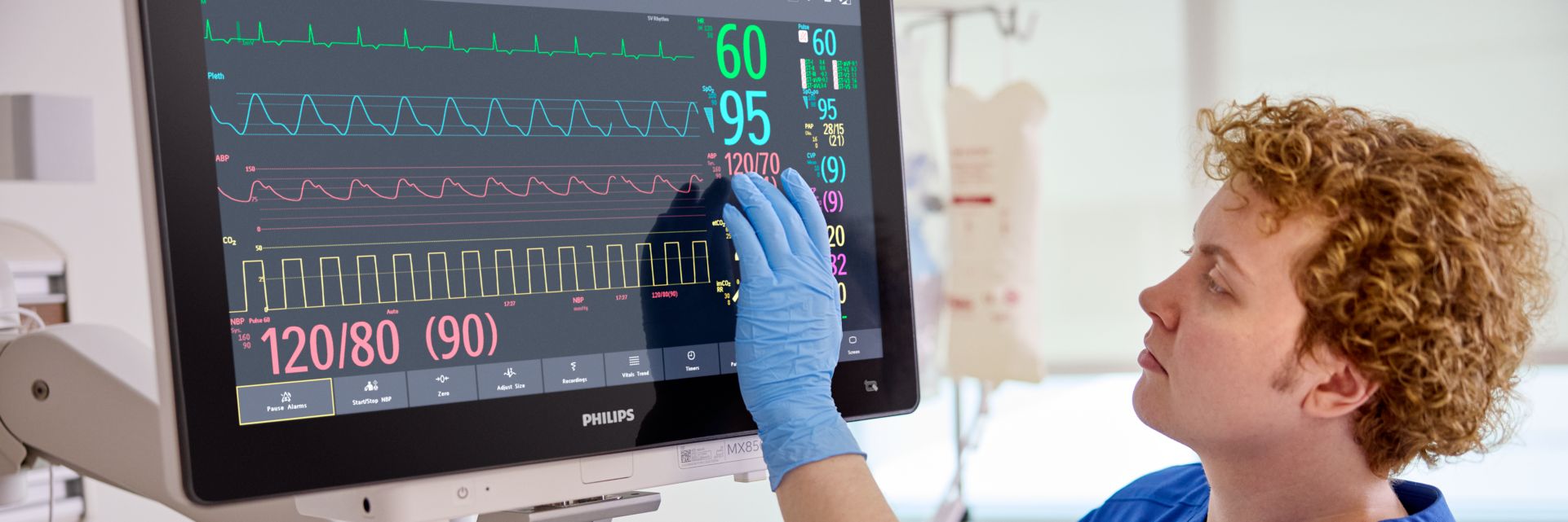 clinician touching monitor