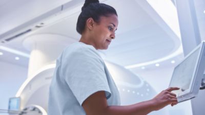 Doctor operating MRI machine in hospital setting