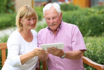 Elder couple smiling together outdoors