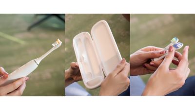 電動歯ブラシとブラシヘッドを見せるリュウ正樹さん