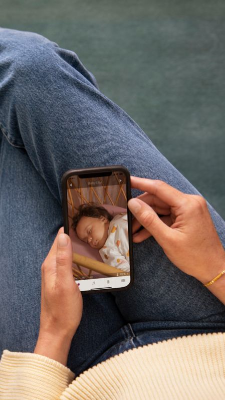 Mom watching the baby via phone