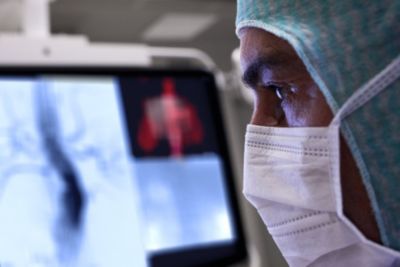 Healthcare professional reviewing lung imaging during COVID 19 diagnosis in hospital