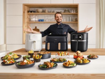 Steffen Henssler with Airfryer models HD9285, NA352 and HD9880 in kitchen
