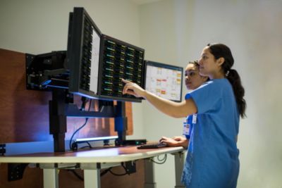 Clinicians monitoring real-time patient data using Philips enterprise patient monitoring ecosystem