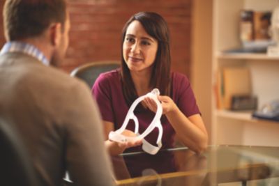 Clinician showing CPAP mask