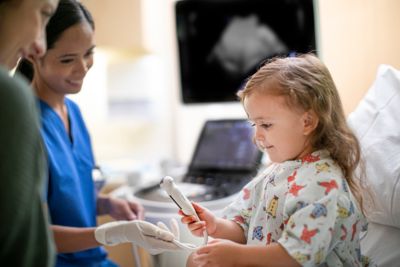 Doctor playing with baby