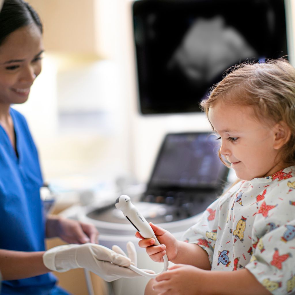 Doctor playing with baby